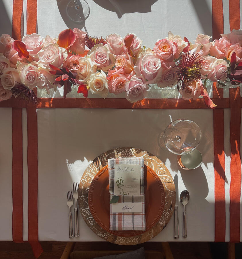 A close look at the autumn table: copper mule cups, pumpkin plates, and layered textures for a cozy seasonal place setting.