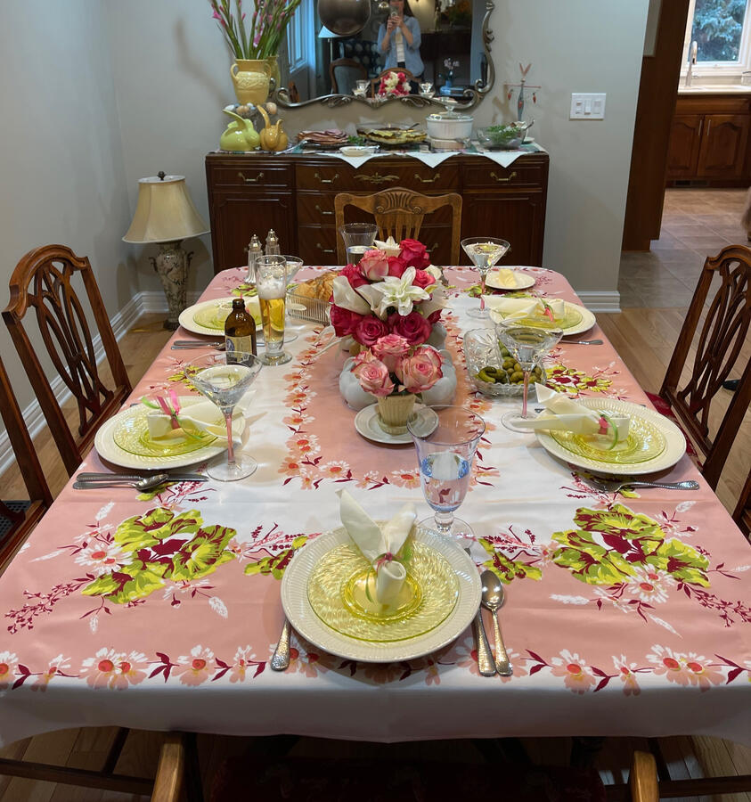 Wedgwood Edme china paired with uranium glass plates, English chintz, and McCoy pottery creates a bright spring table.